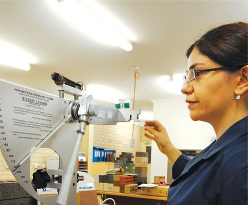 A photo of a staff member using some machinery in an office