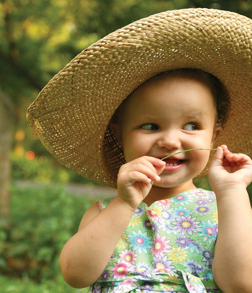 A photo of a baby wearing a hat